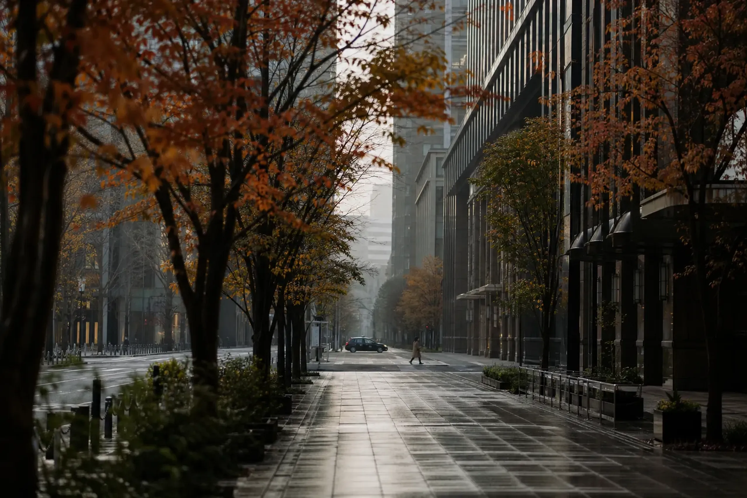 Quiet early morning street in Marunouchi Tokyo with minimal pedestrians