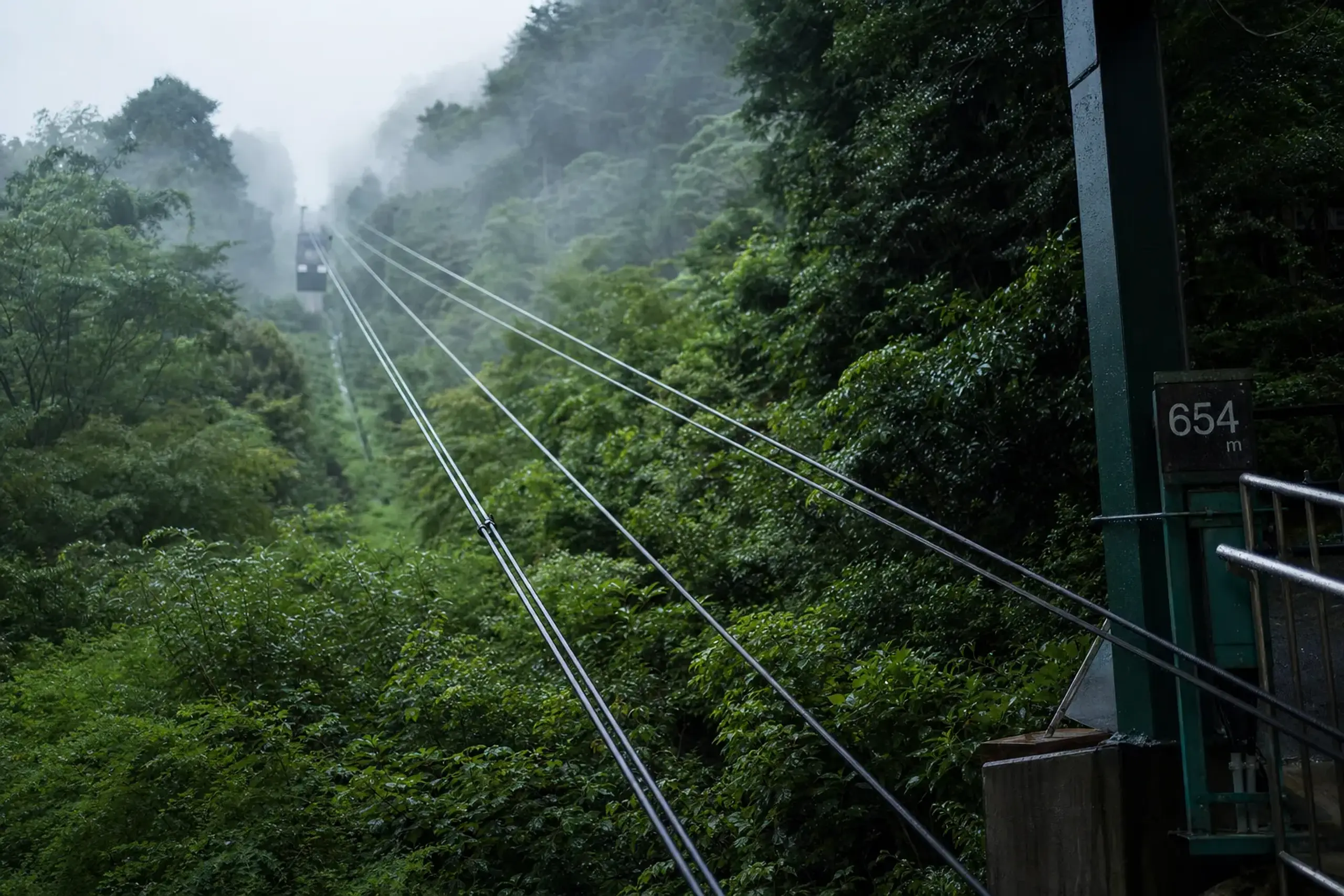 the Eizan Cable Car station at 654 metres on Mount Hiei, with its mountainside cables ascending through summer greenery toward Enryaku-ji