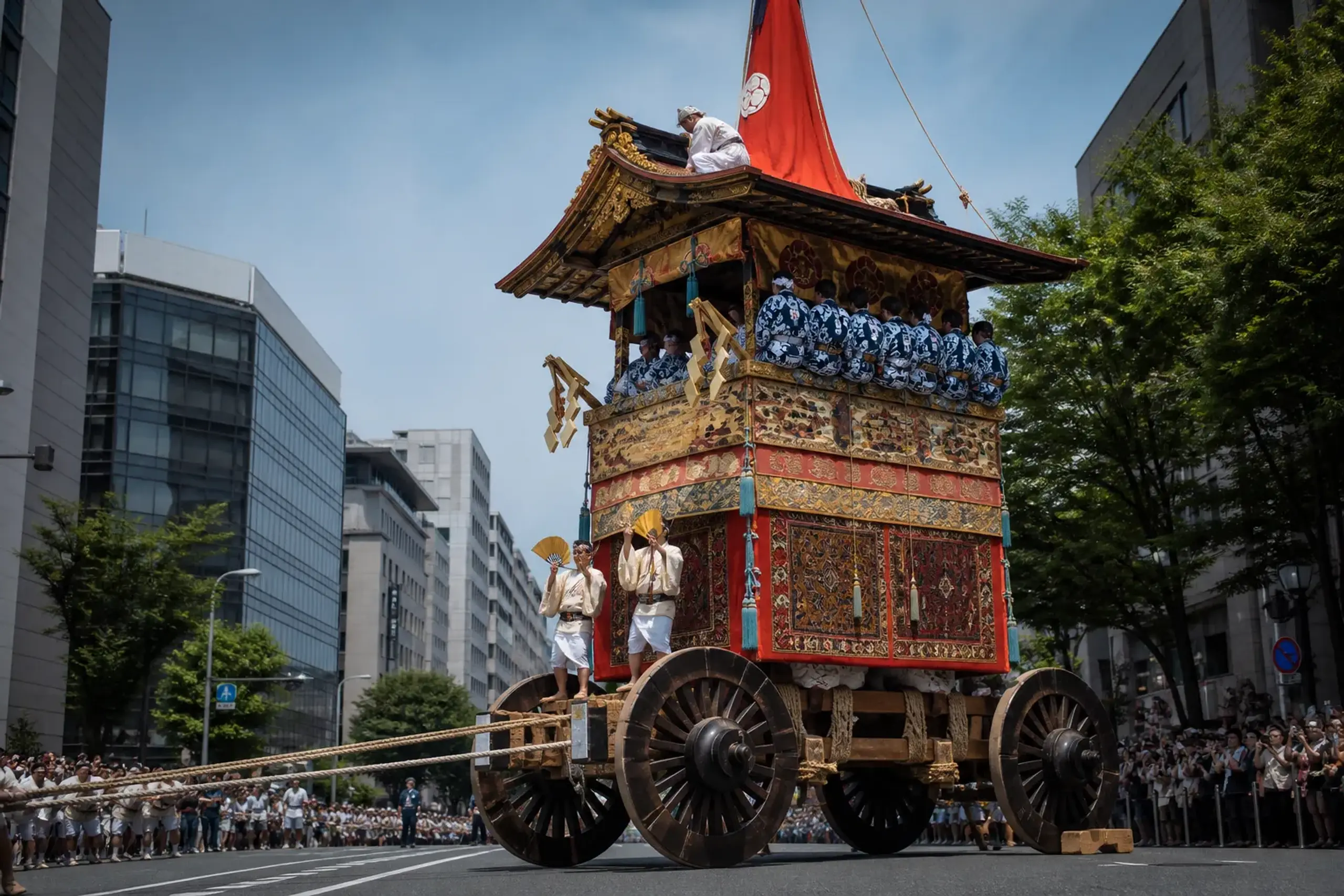 Gion Matsuri yamahoko float procession in Kyoto with spectators watching from behind barriers