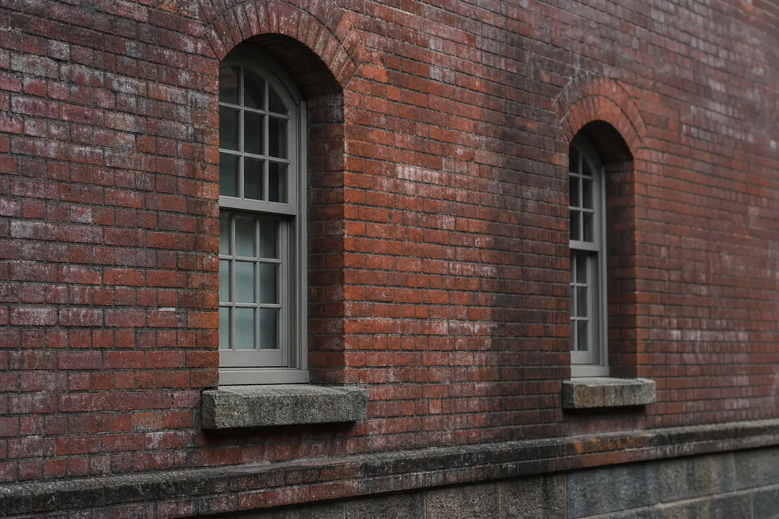 Close view of red-brick arched windows at a preserved historic building in Nara