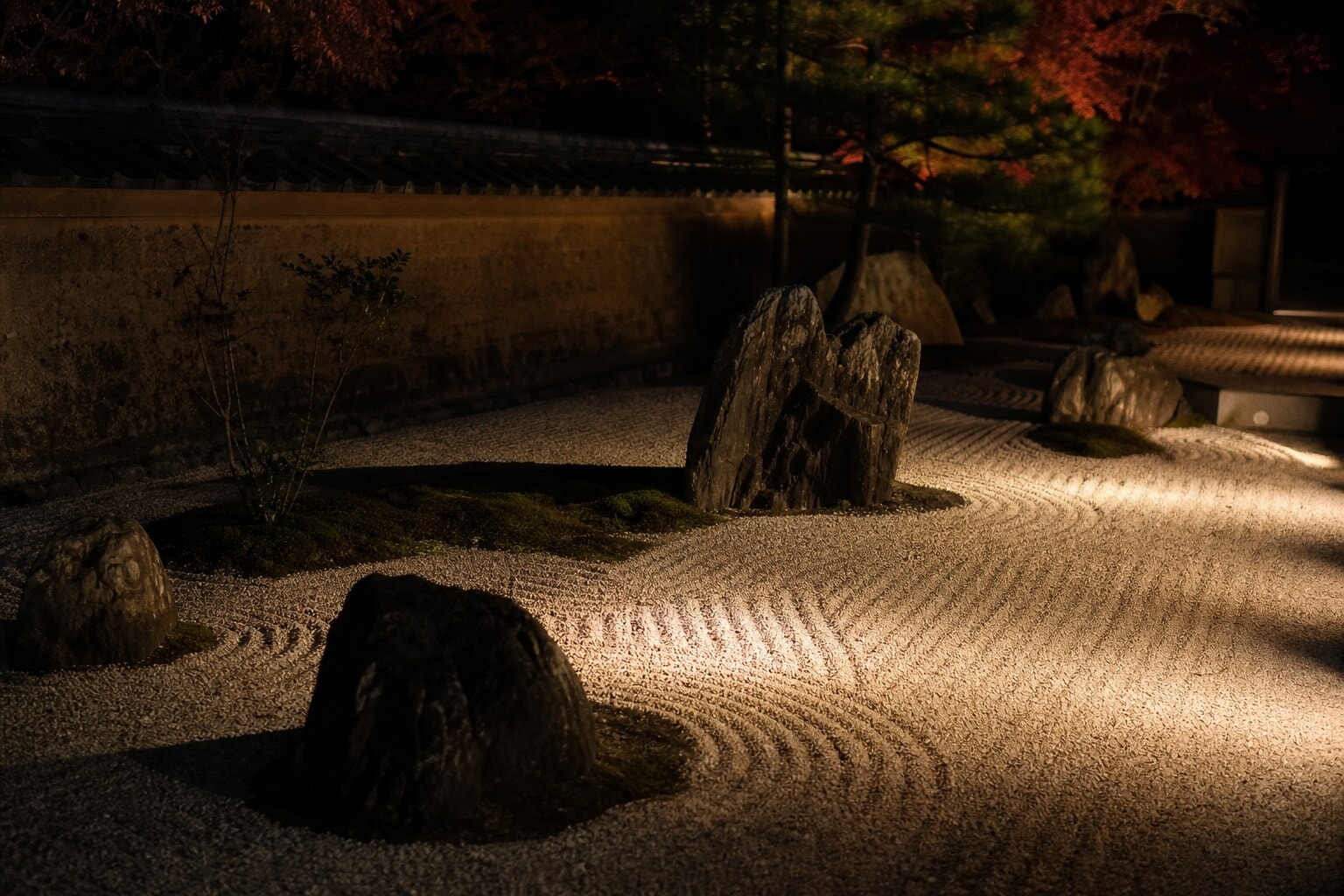 Illuminated dry landscape rock garden at night in Kyoto, Japan