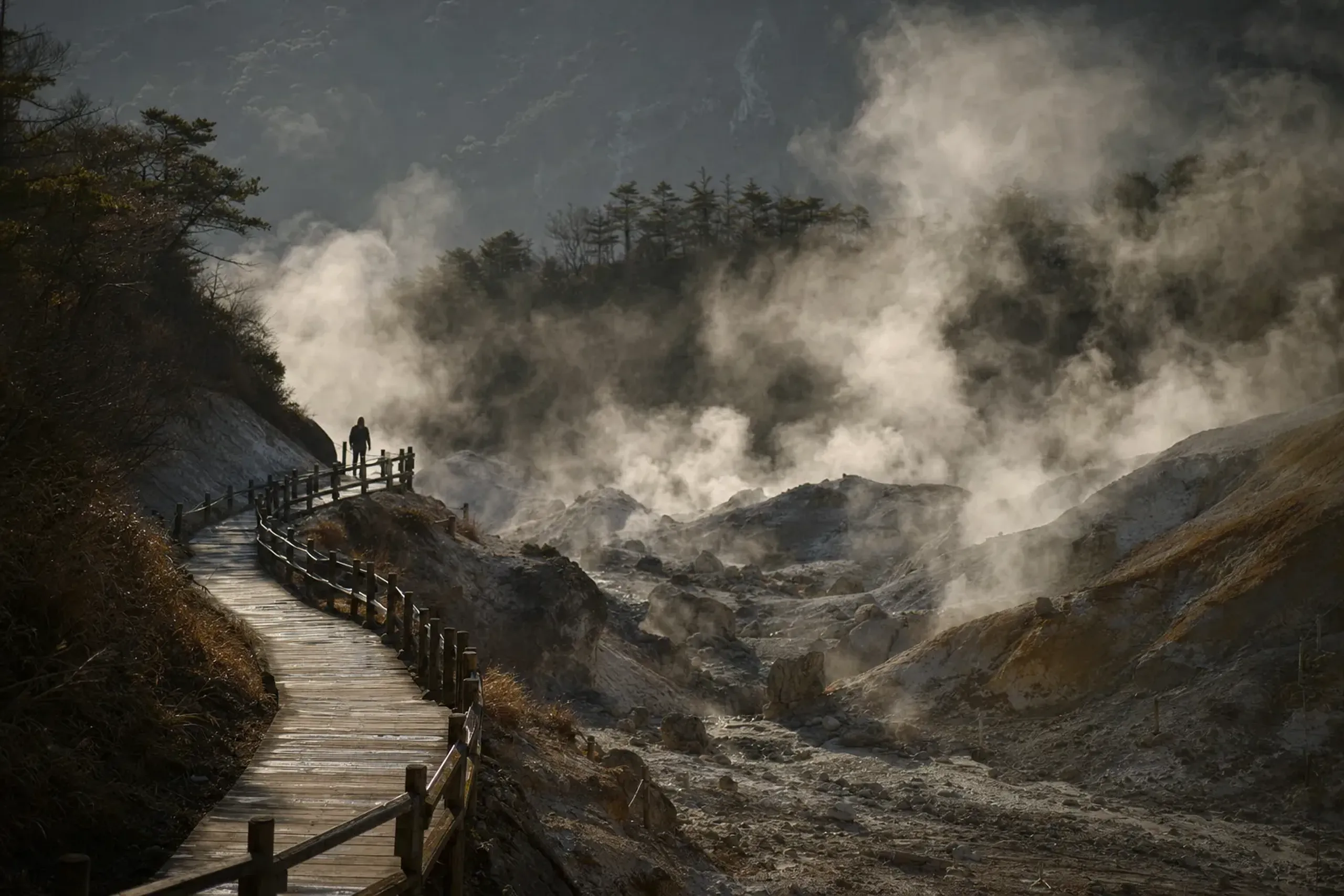 The steaming volcanic hot spring vents and sulfurous white fumaroles of the Unzen Jigoku 'hells' amid the mountainous landscape near Nagasaki