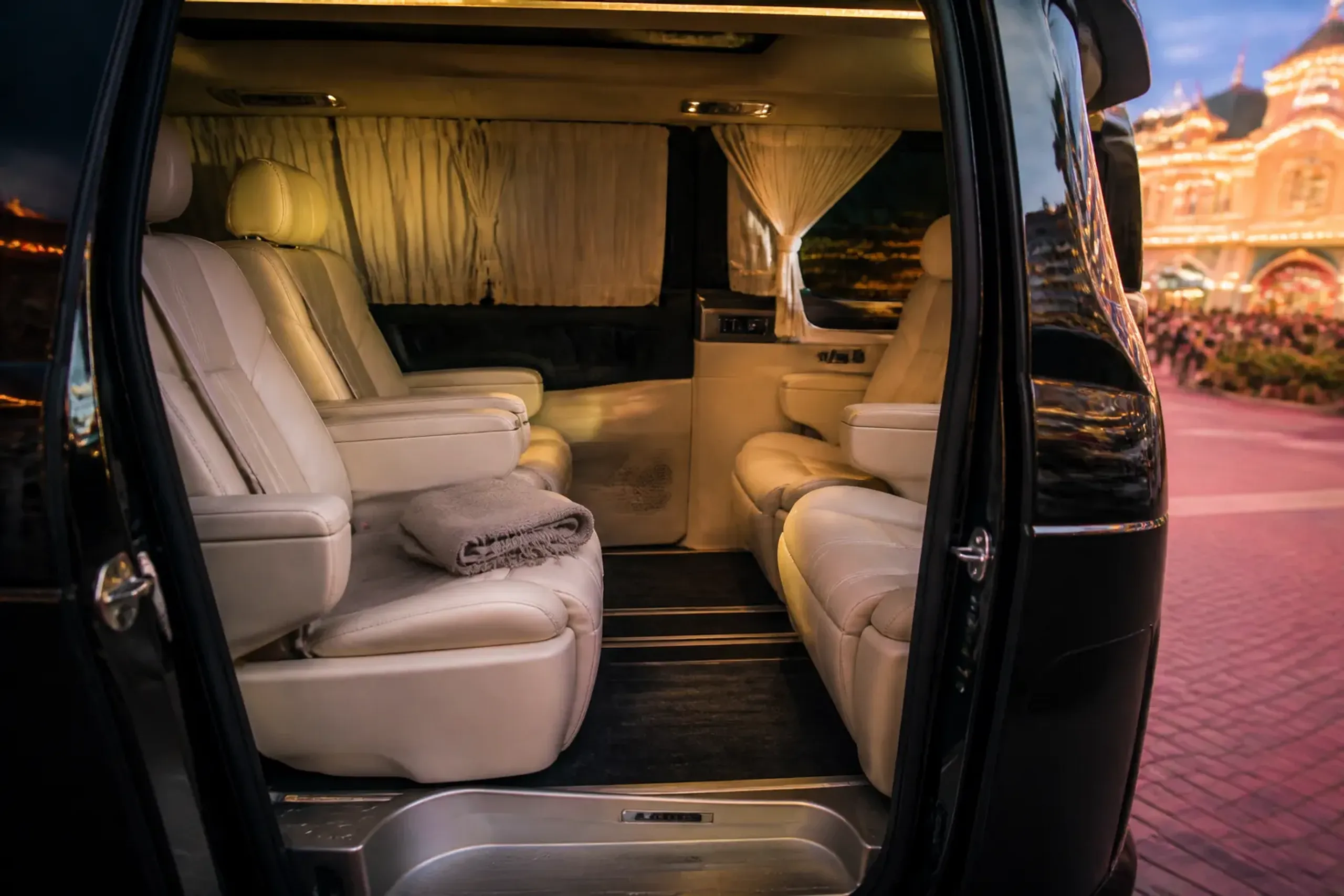 Interior of a luxury chauffeured minivan with leather seats used for private Disney transfers