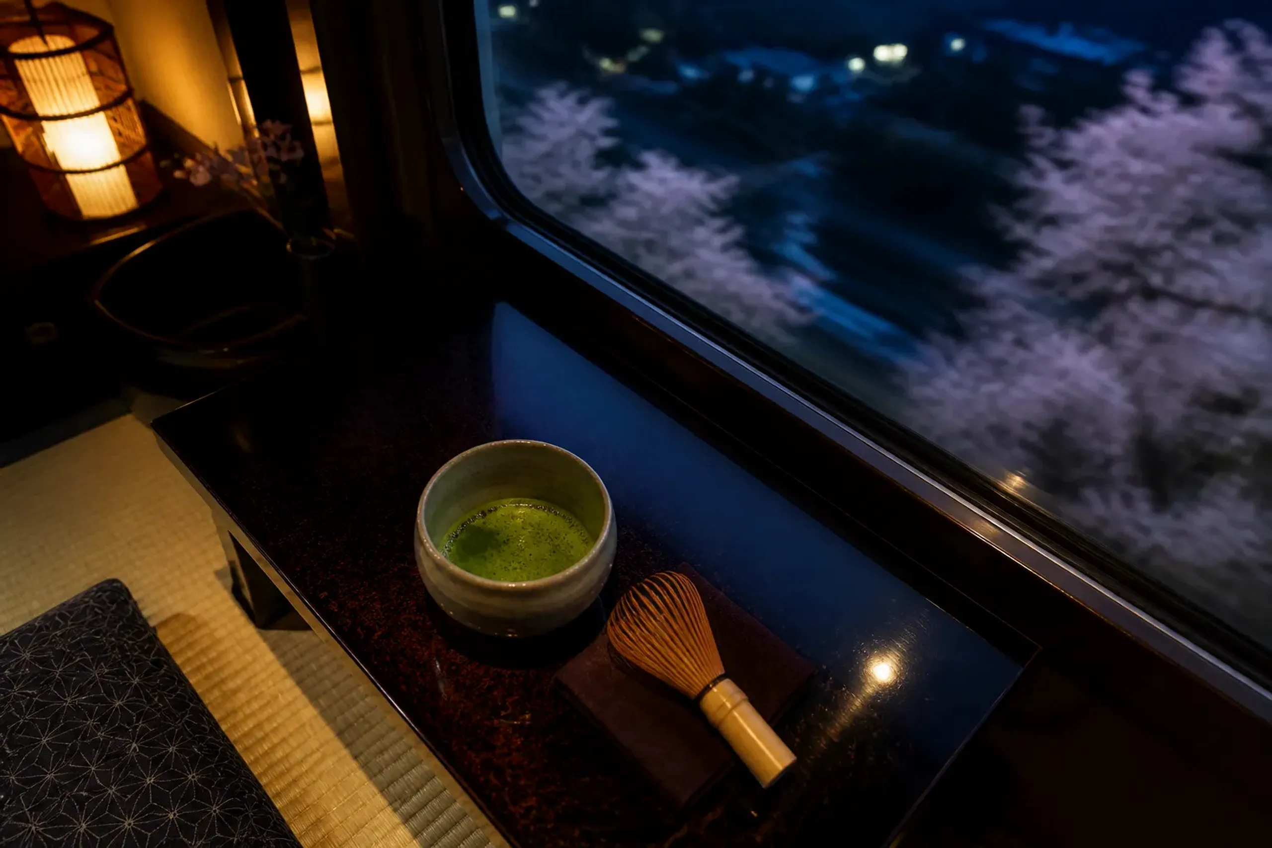 A traditional Japanese tea ceremony setup inside the ryurei-style space on the Seven Stars train.