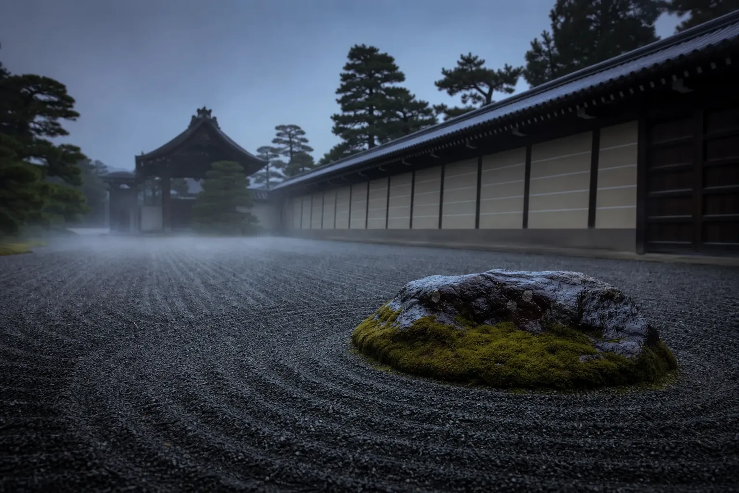 Empty Kyoto temple garden at dawn with mist over raked gravel and moss, timed for privacy