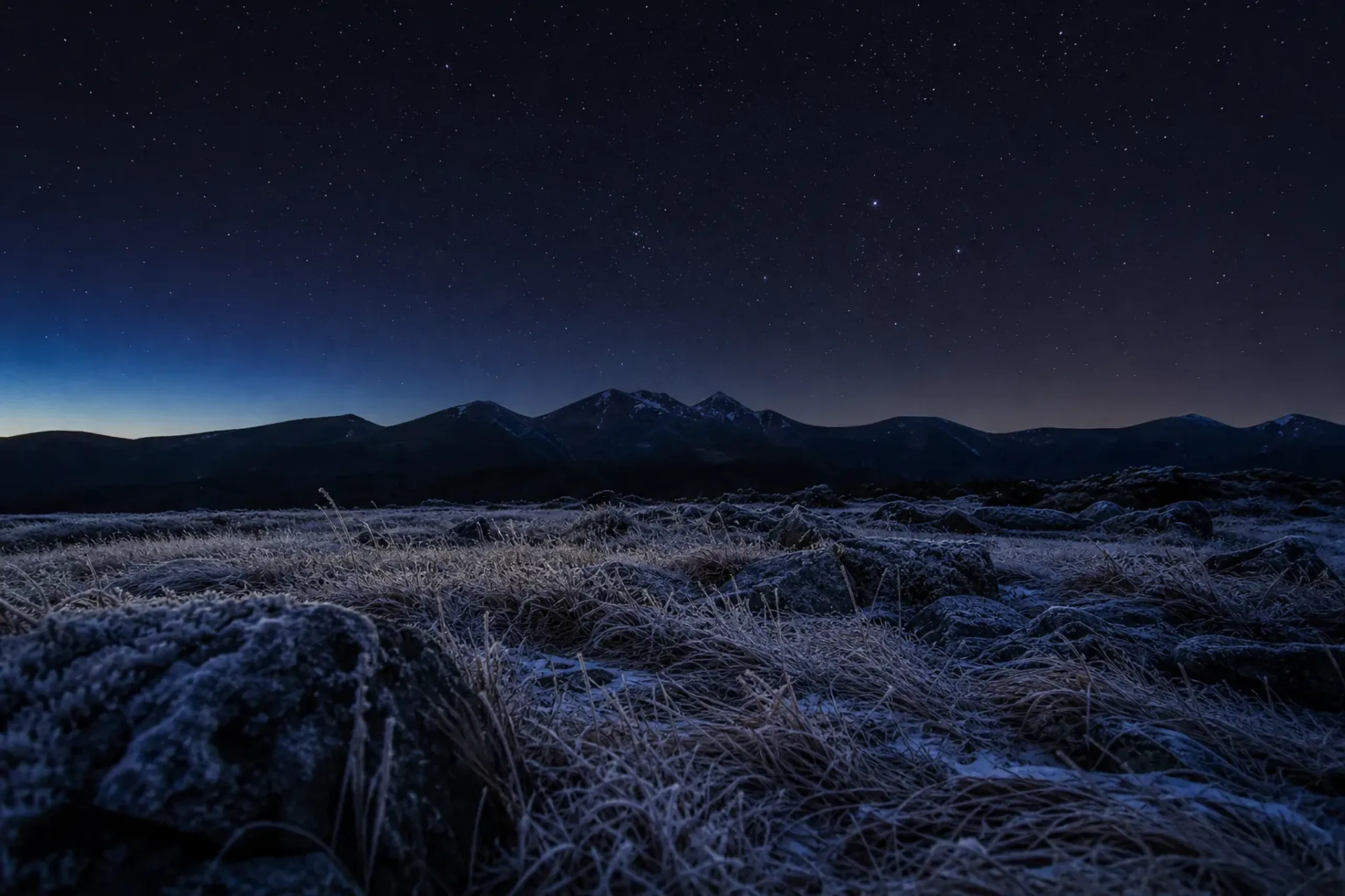 Frosted alpine foreground under a clear starry sky in central Hokkaido