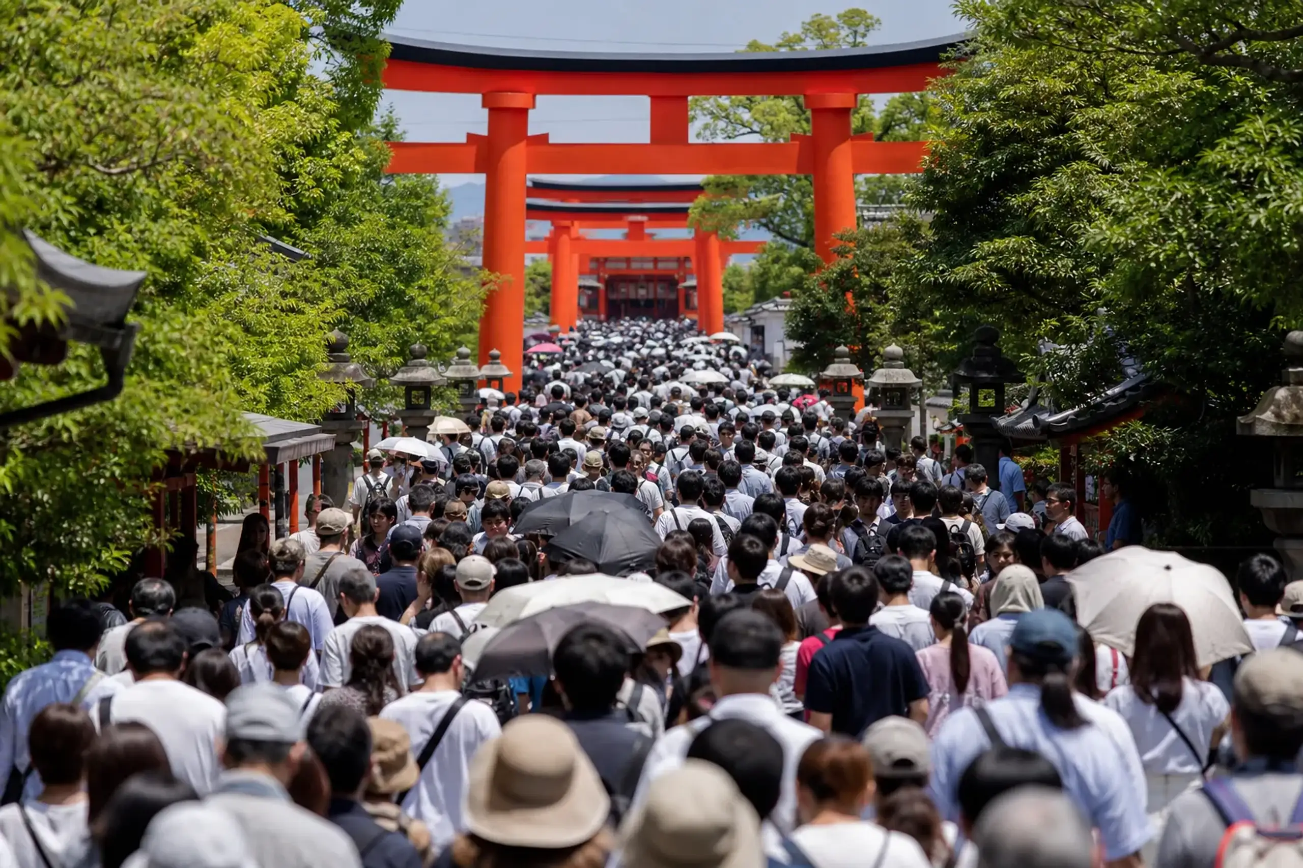 Crowded midday approach path at Fushimi Inari Taisha in Kyoto