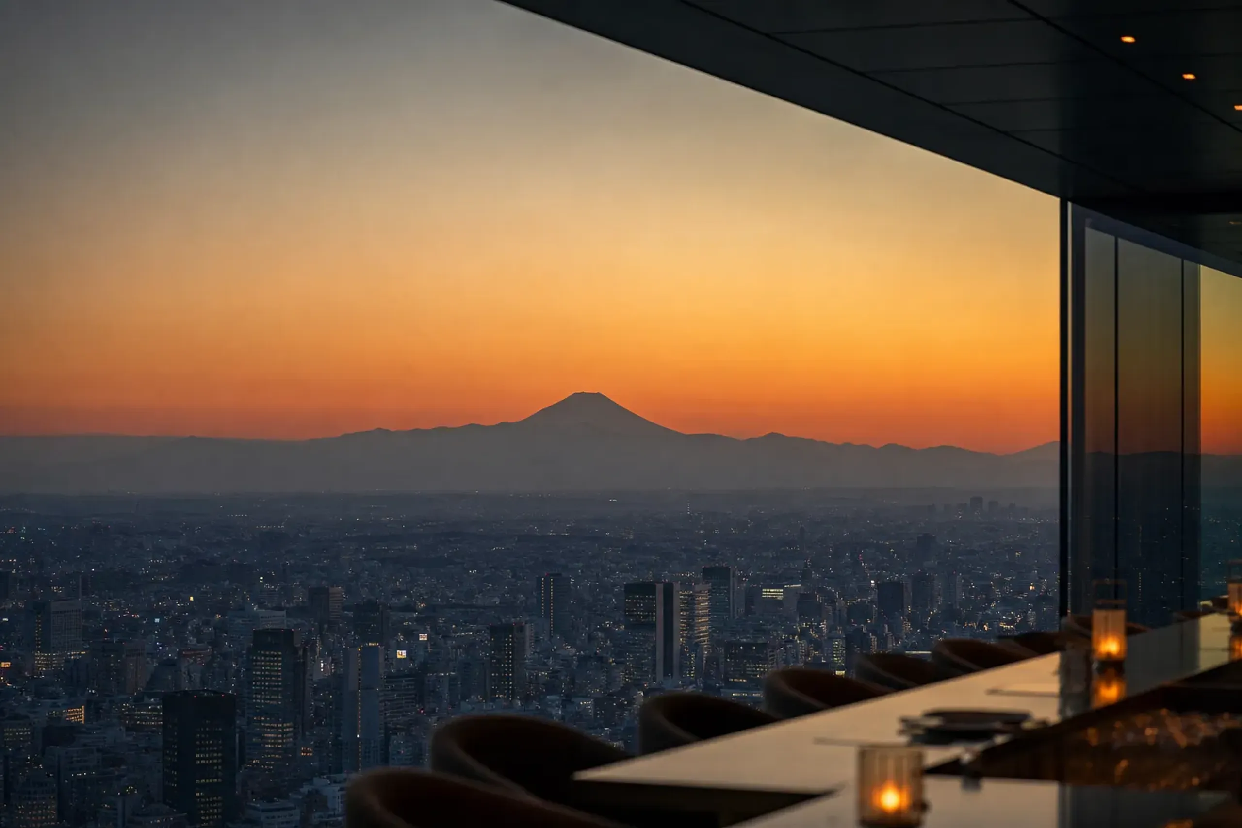 Amber sunset over Tokyo with Mount Fuji silhouetted, seen from Tokyo Skytree observation level