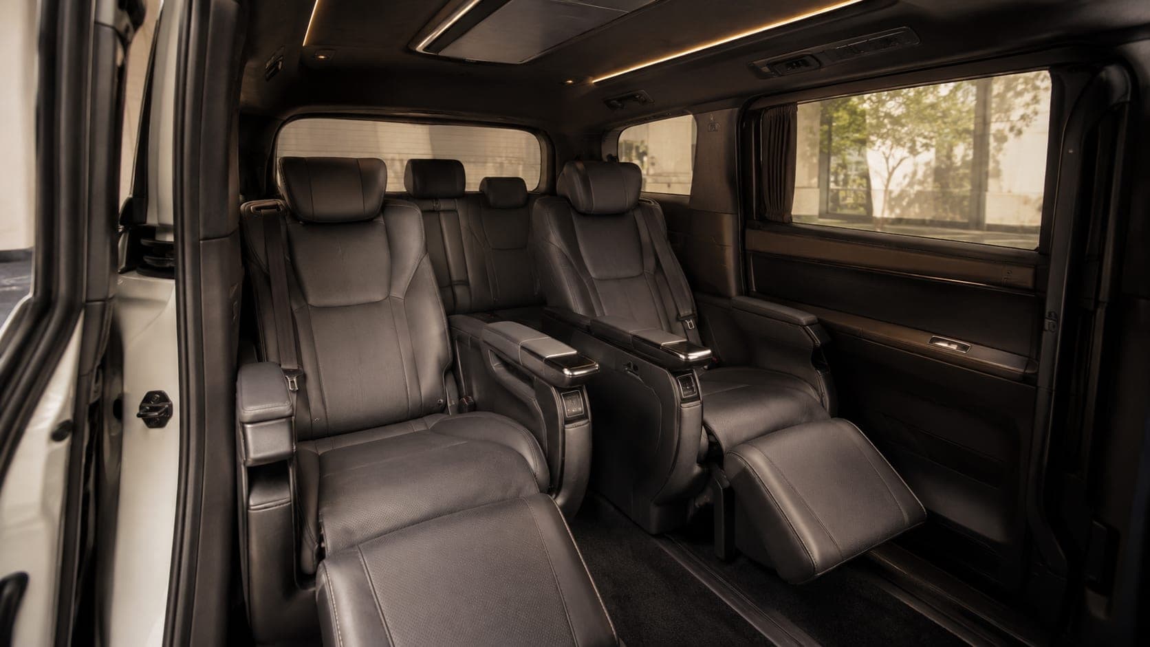 Interior view of the Toyota Alphard captain's chairs and rear bench