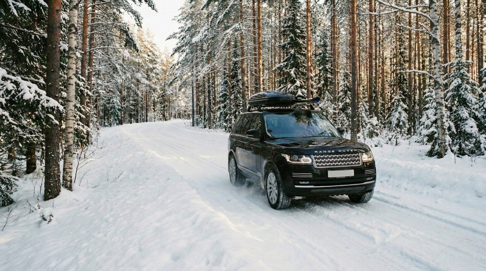 Luxury 4WD transport vehicle on a snowy road in Daisetsuzan National Park.